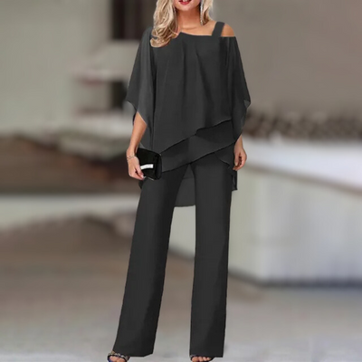 Experience refined style with this elegant chiffon ensemble featuring an asymmetric top paired with flowing wide-leg pants.