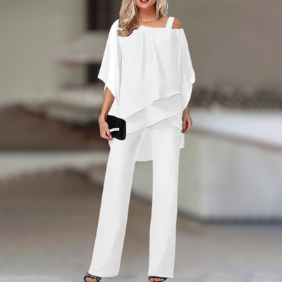 Experience refined style with this elegant chiffon ensemble featuring an asymmetric top paired with flowing wide-leg pants.